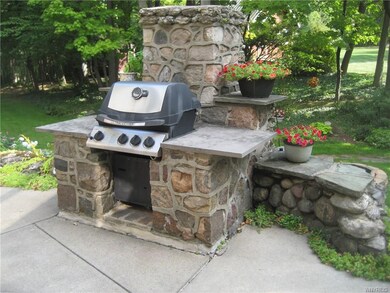 Built in gas grill.  Oversized patio with a retrac