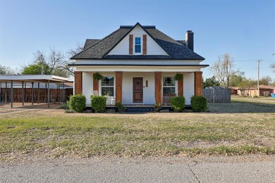 View of front facade with a porch and a front yard