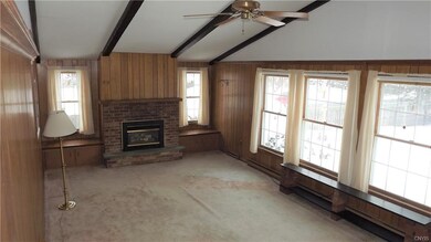 Large family room overlooking rear yard with gas f