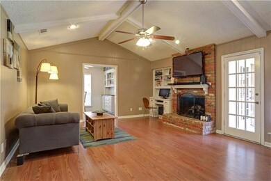 Living Room towards Kitchen with Rear Patio Entry