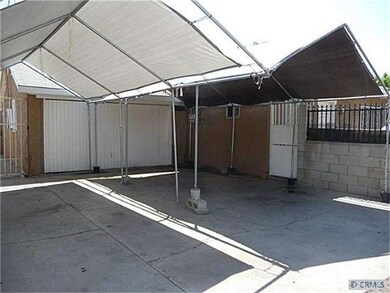 Back of 2nd unit with ample parking stalls and fen