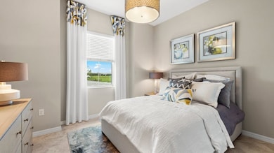 Located near the entry is one of the home’s two secondary bedrooms to provide a private space for fa