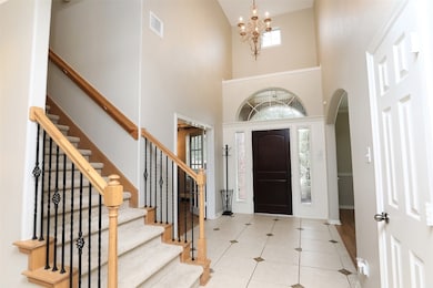 Upon arrival, guests are greeted by a gracious foyer featuring soaring ceilings and tasteful millwork flanked by a formal dining room and office perfect for a work-from-home setup.
