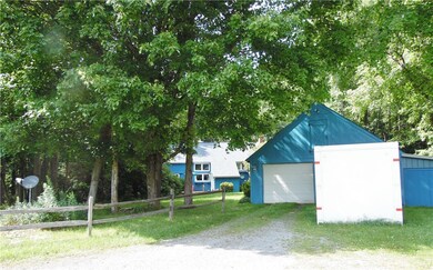 Two car garage with additional equipment space and