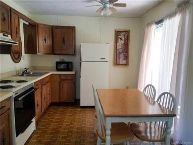 Downstairs Kitchen in Large White Home 5BR/3BA
