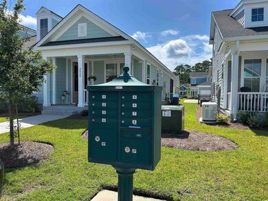 Front of home featuring mail area and front yard.