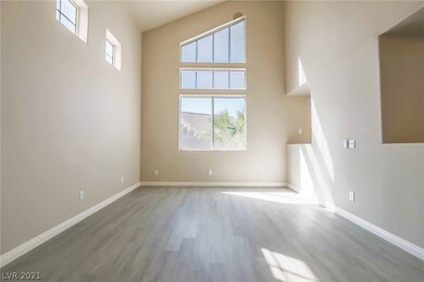 Spacious living room with vaulted ceiling.