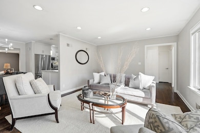 Living Room with view of the entrance and kitchen