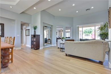 Living area featuring light wood-style floors, rec