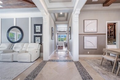 Entrance foyer with light tile patterned floors, b