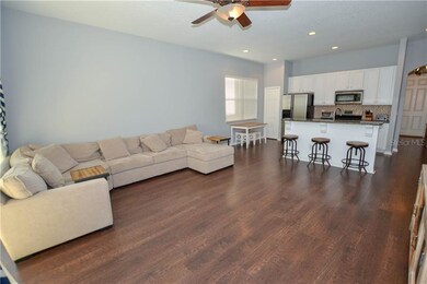 Spacious family room connected to open concept kit