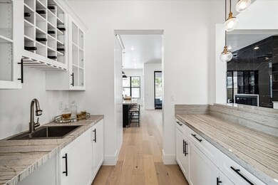 This stylish butler's pantry doubles as a wet bar,