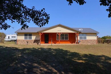 Single story home with a front lawn
