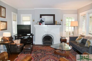 Living room with fireplace and abundance of window