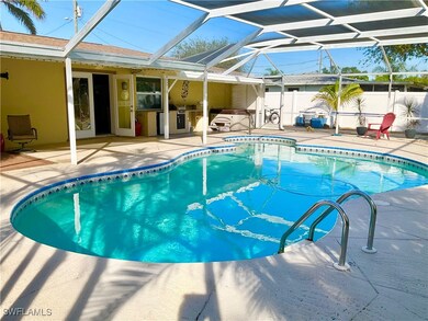 View of swimming pool with a patio area and glass