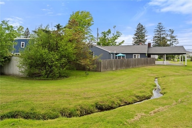 View of property including shed from the back