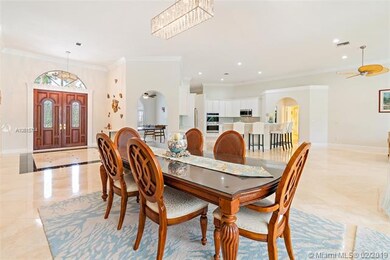 Open great room with 12ft volume ceilings and crow