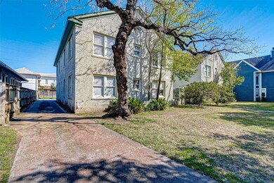 The driveway on the left of the building leads to the back carport area