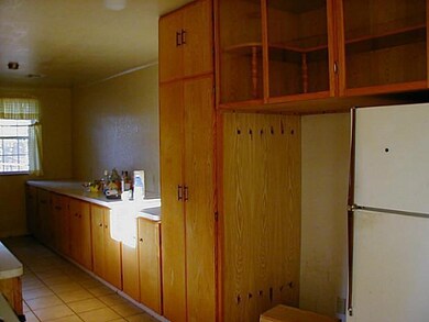 Kitchen. Another view of kitchen.