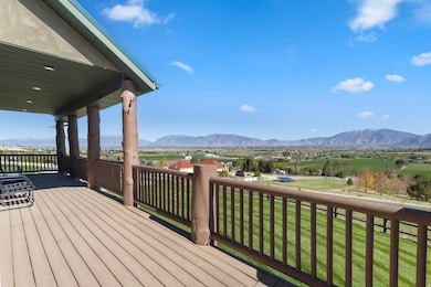 Terrace featuring a mountain view and a yard