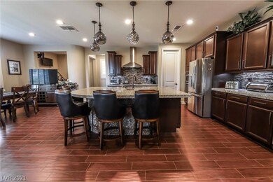 Gourmet kitchen features island, granite, TWO walk