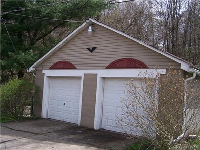 Two car garage has electric and auto garage door o