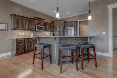 Granite island and counters with tons of cabinets 