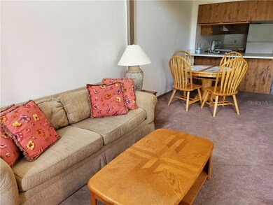 View of living room/dining area combo with kitchen