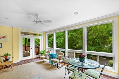 Spacious sunroom overlooking private back yard