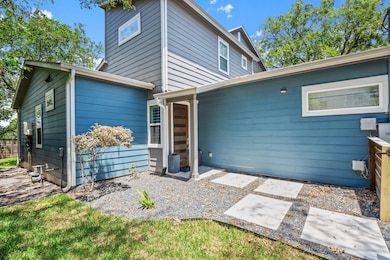 Rear view of property featuring a patio