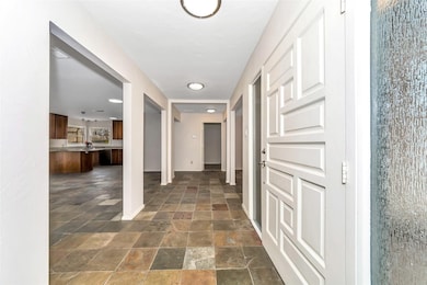 Corridor with dark stone finish flooring