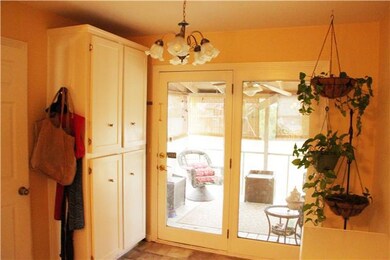 KITCHEN VIEW GOING INTO SUNROOM OFF BACK OF THE HOUSE