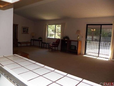 View out to the living room from the kitchen. Slid
