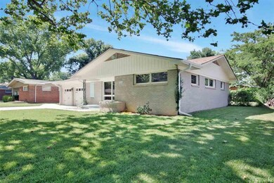 Newer porch and partial driveway.