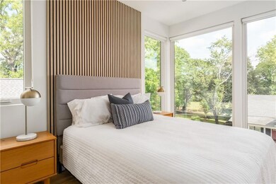 Bedroom with multiple windows