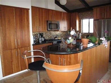 Cherry cabinets, jennair stove, cesarstone counter