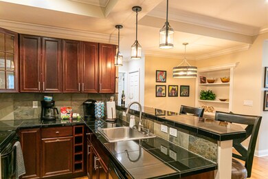 Kitchen bar is open to living and dining areas.  T