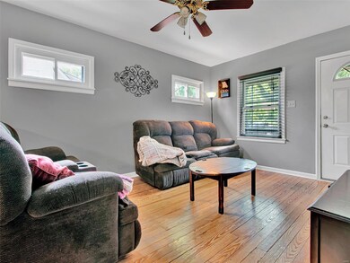 Main floor living room with hardwood floors and tons of natural light.
