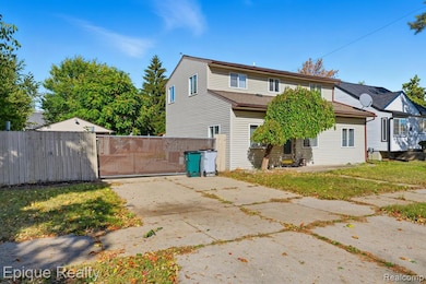 Back of house with a gate