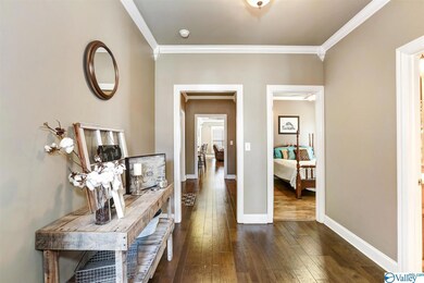 Features include crown and corner molding and hardwood flooring.  The home has 9' smooth ceilings throughout.