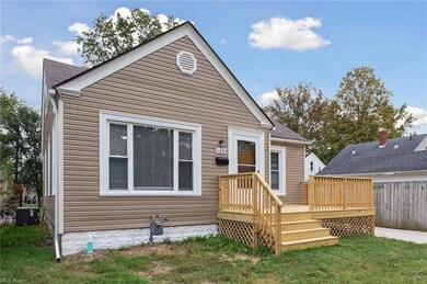 View of front of house featuring a wooden deck, a 