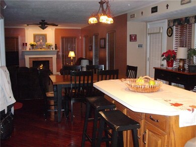 Standing in Kitchen looking into family room.  Gre