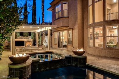 Swimming pool and outdoor living space with a TV,
