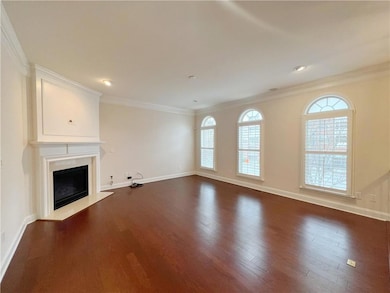 Unfurnished living room with a fireplace with flus
