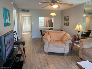 Living room with vinyl  flooring and ceiling fan