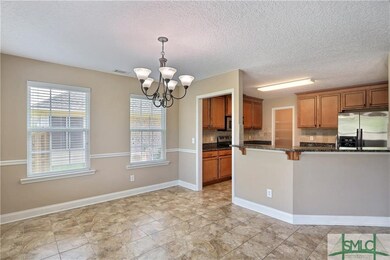 Breakfast and kitchen have tile flooring. Large wa