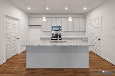 You'll love gathering with loved ones around this spacious center island! 

HOME IS UNDER CONSTRUCTION - Photo is from builder's library and shown as an example only (colors, features and options will vary).