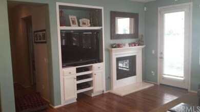 Custom built in entertainment area next to gas fireplace.