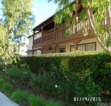 Side view of the home with both the patio and deck