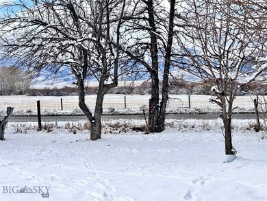 View of yard covered in snow